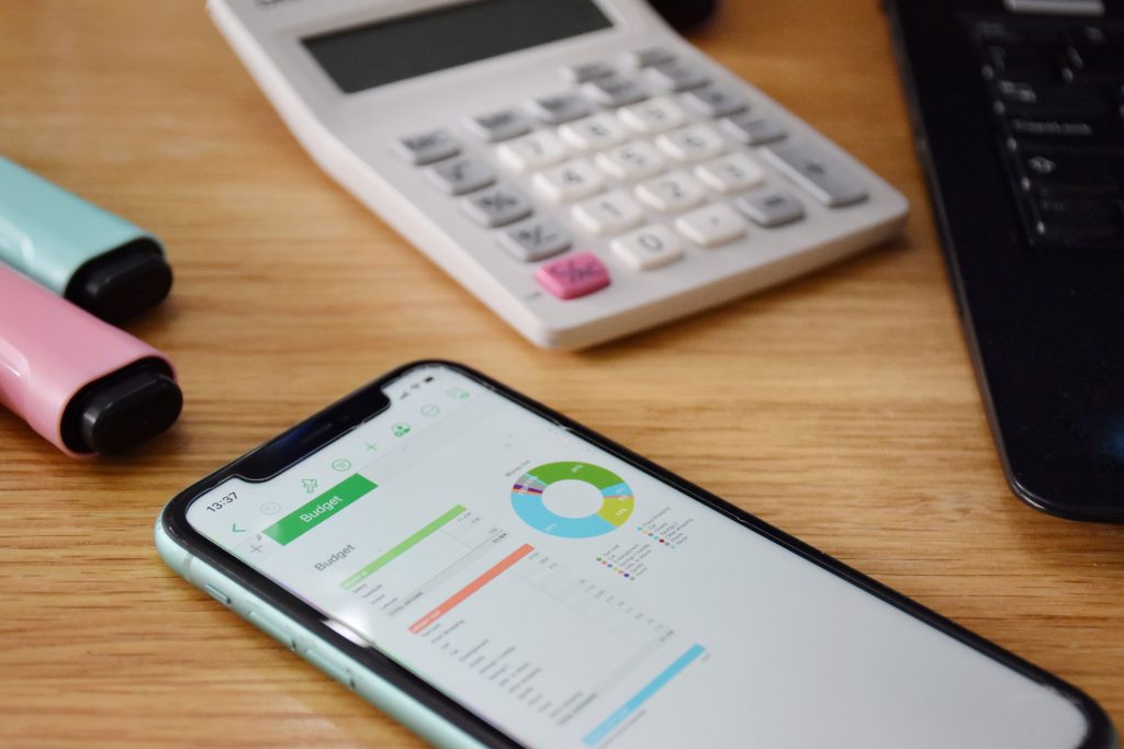 budgeting with phone calculator and colorful pen 2026 03 09 03 59 53 utc 1