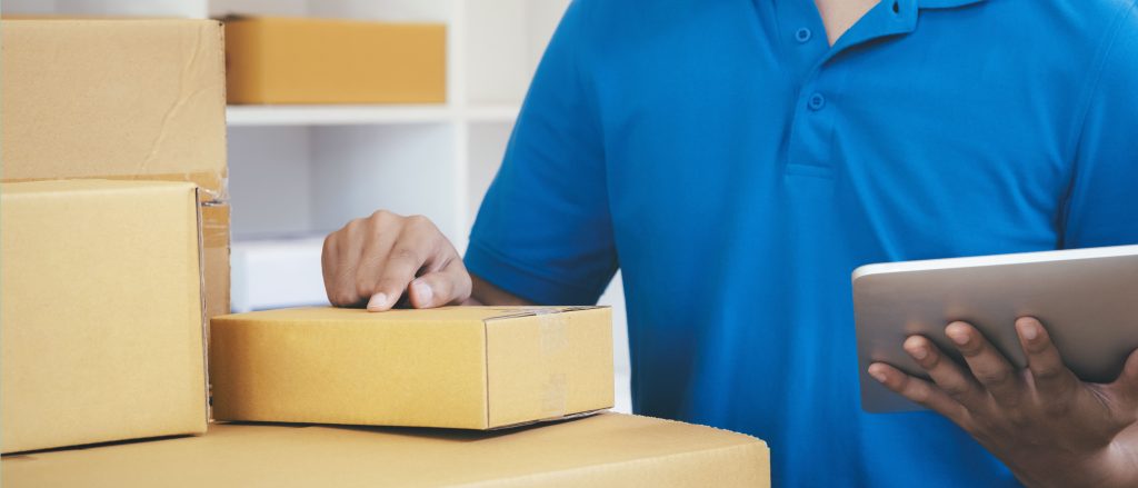 delivery man with tablet checking packages in ware 2026 03 24 23 11 07 utc 1