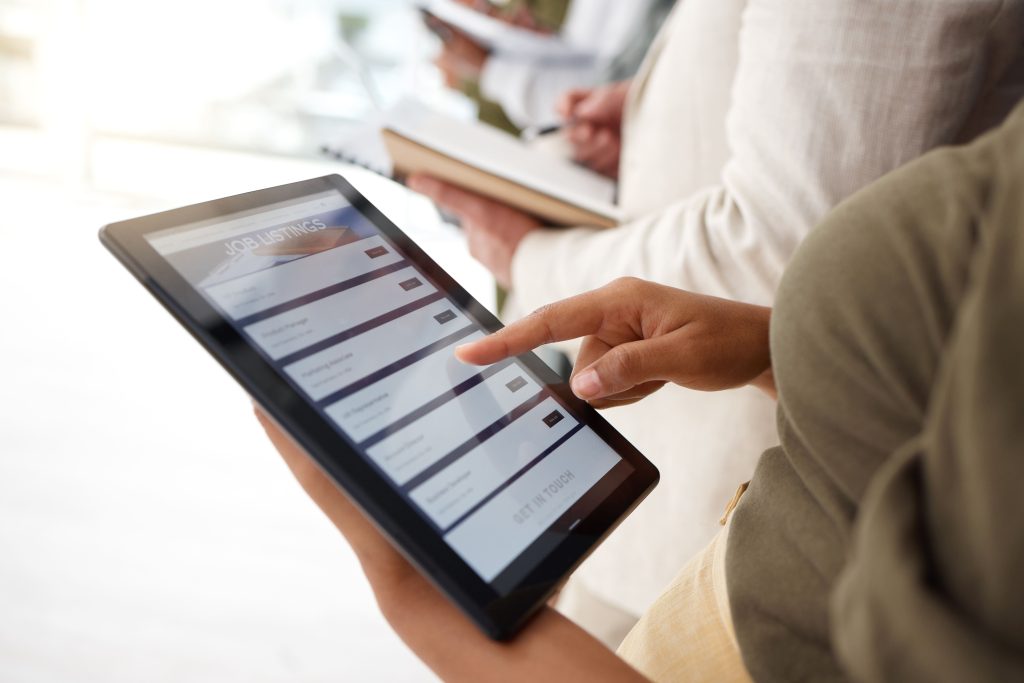 woman hands and tablet checking job listing for h 2026 03 25 04 04 04 utc 1